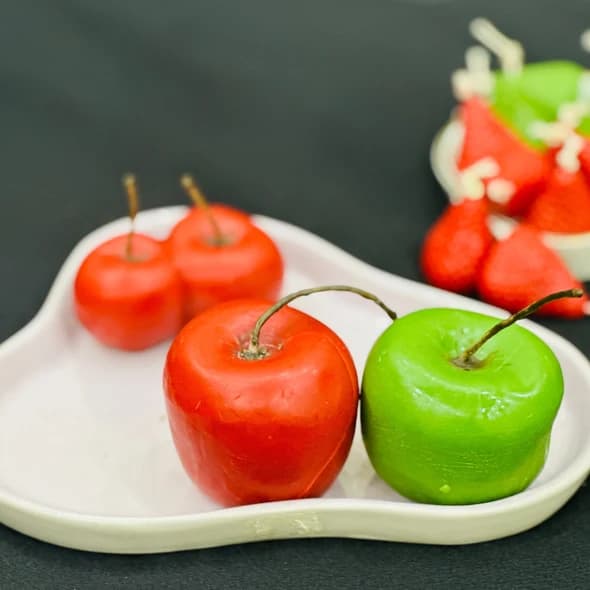 Fruit-scented candle melts, freshly cut